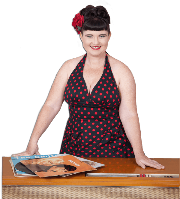 Eilis Hughes, otherwise known as DJ Oily Shoes, with a 1950s record player and some records